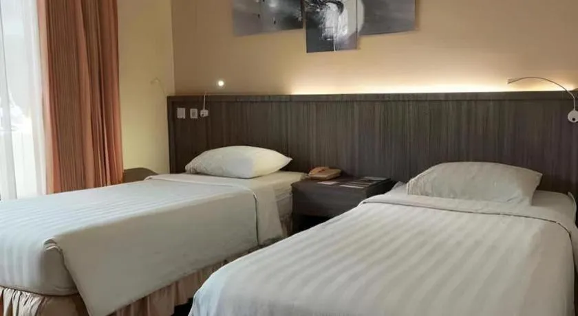Bed in Purnama Hotel