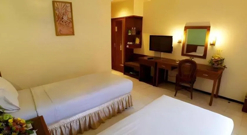 Bed in Purnama Hotel