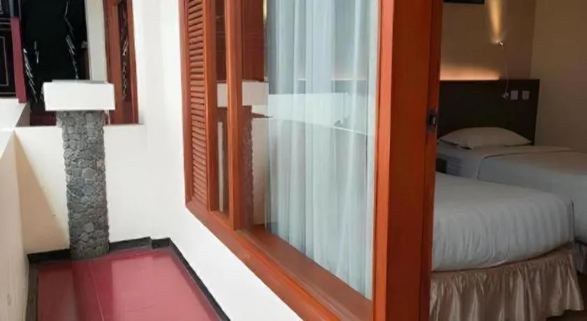 Bed in Purnama Hotel
