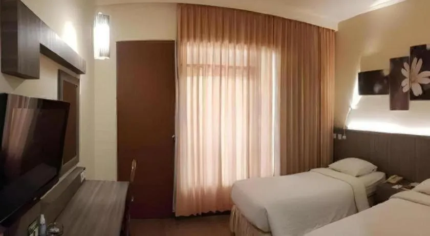 Bed in Purnama Hotel