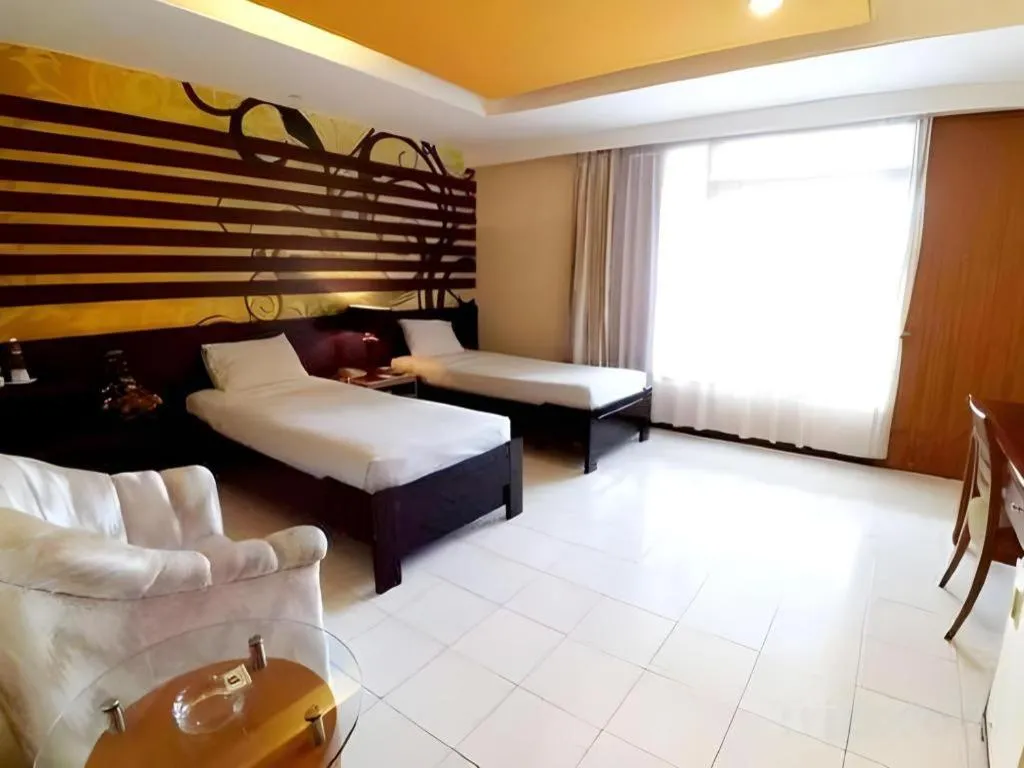 Bed in Purnama Hotel