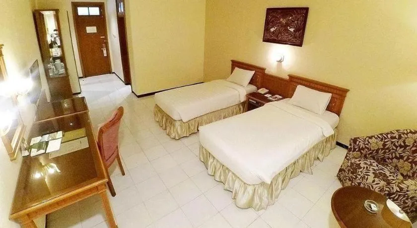 Bed in Purnama Hotel