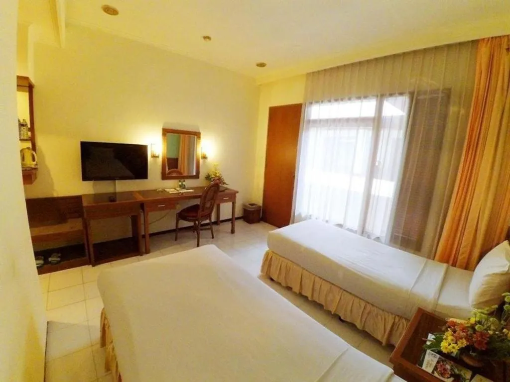 Bed in Purnama Hotel