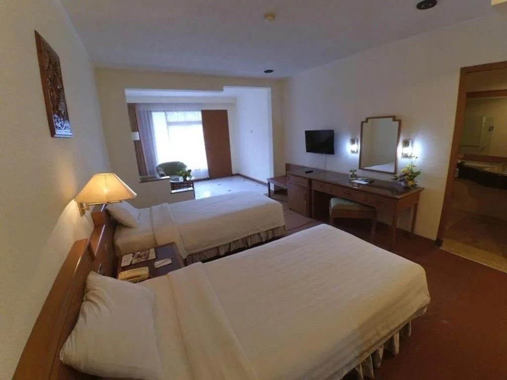 Bed in Purnama Hotel