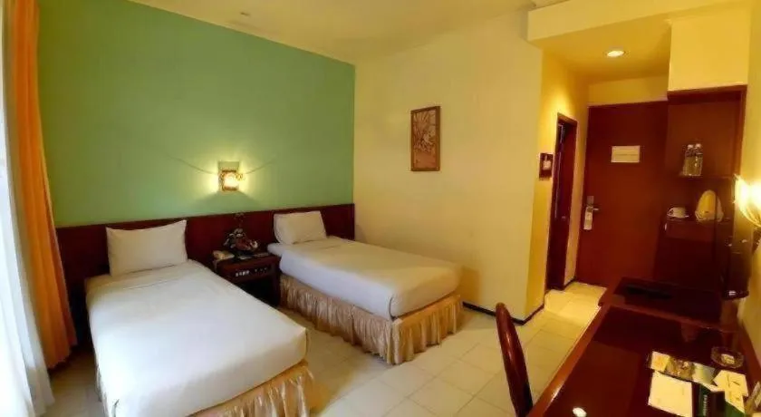 Bed in Purnama Hotel
