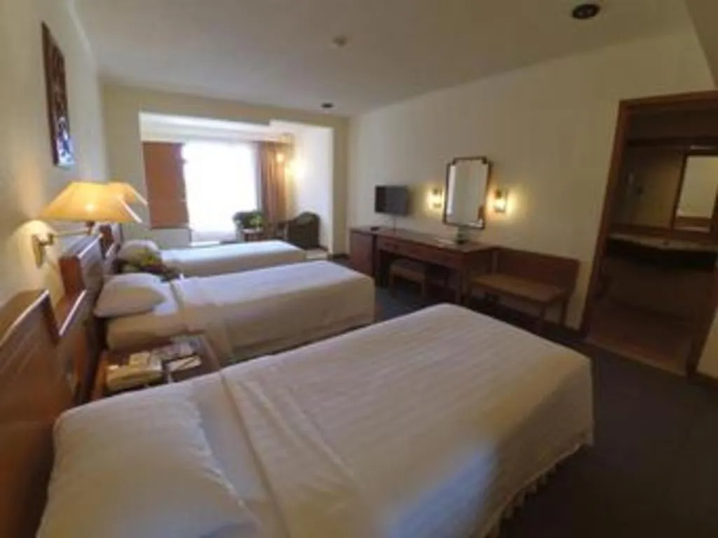 Bed in Purnama Hotel