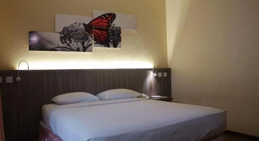 Bed in Purnama Hotel