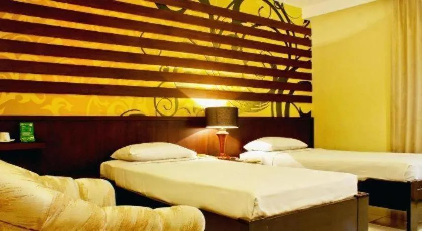 Bed in Purnama Hotel