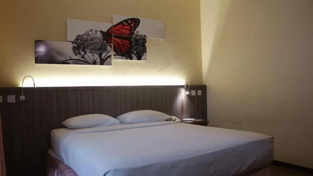 Bed in Purnama Hotel