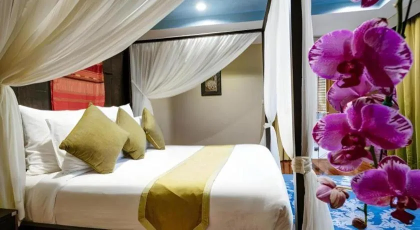 Bed in Baan Souchada Resort & Spa