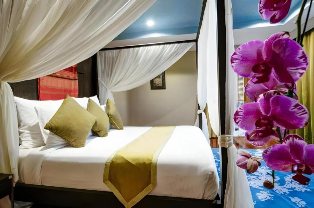 Bed in Baan Souchada Resort & Spa