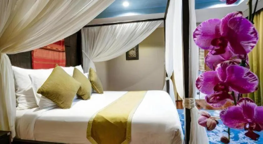 Bed in Baan Souchada Resort & Spa