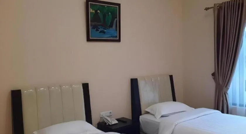 Bed in Raz Hotel and Convention