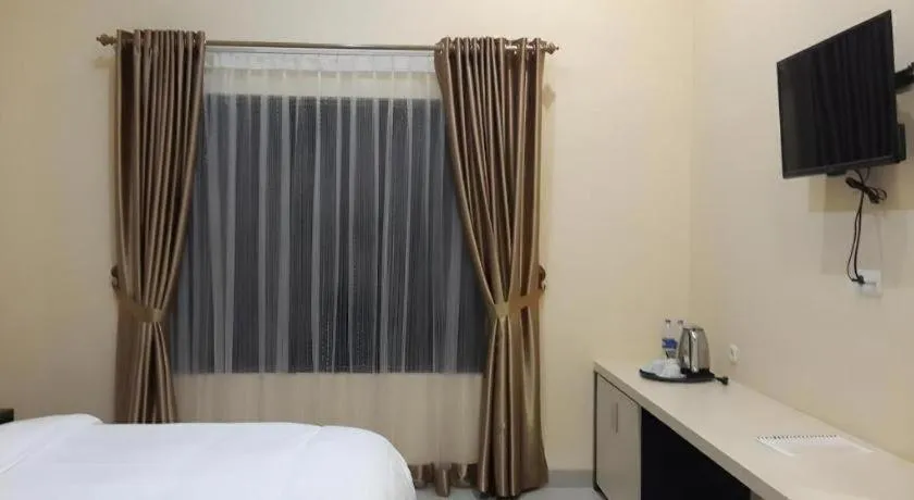 Bed in Raz Hotel and Convention