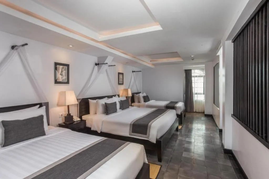 Bed in The Grand Cyclo Boutique Suite & Spa