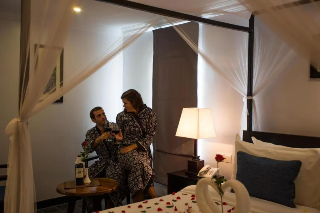 Bed in The Grand Cyclo Boutique Suite & Spa