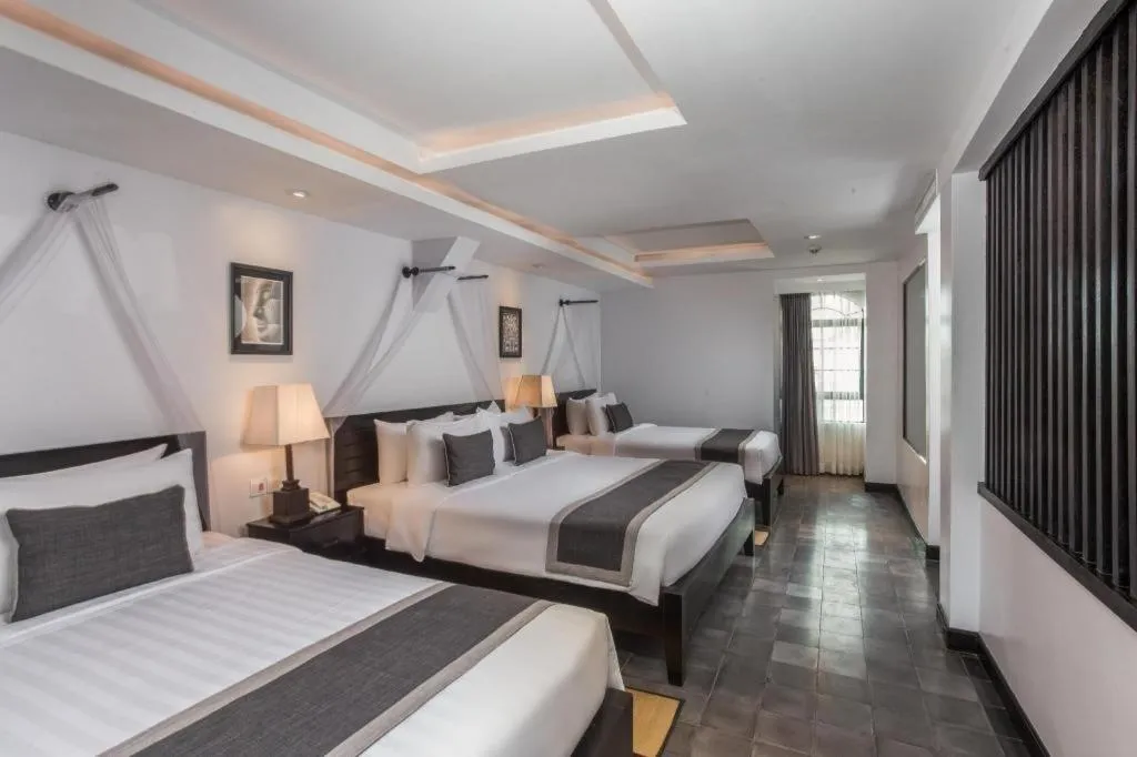 Bed in The Grand Cyclo Boutique Suite & Spa