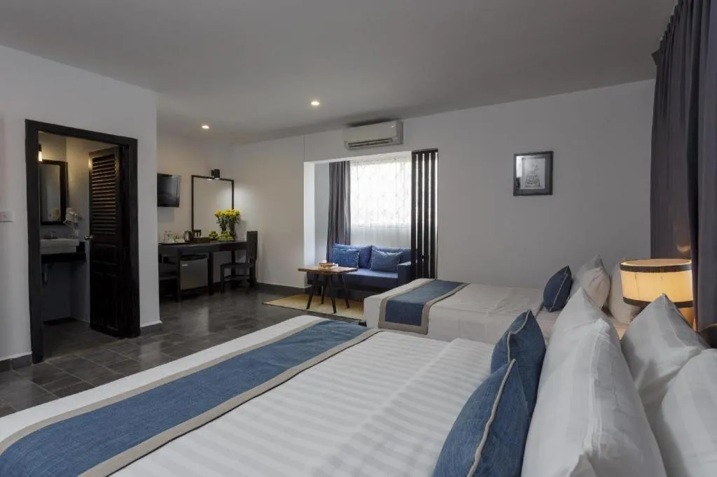 Bed in The Grand Cyclo Boutique Suite & Spa