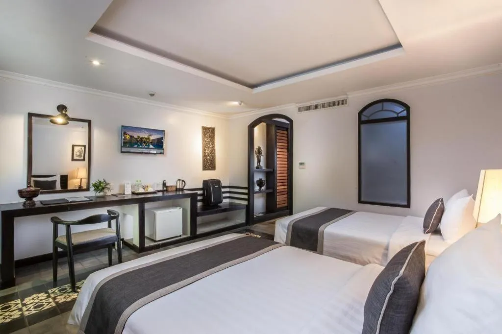 Bed in The Grand Cyclo Boutique Suite & Spa