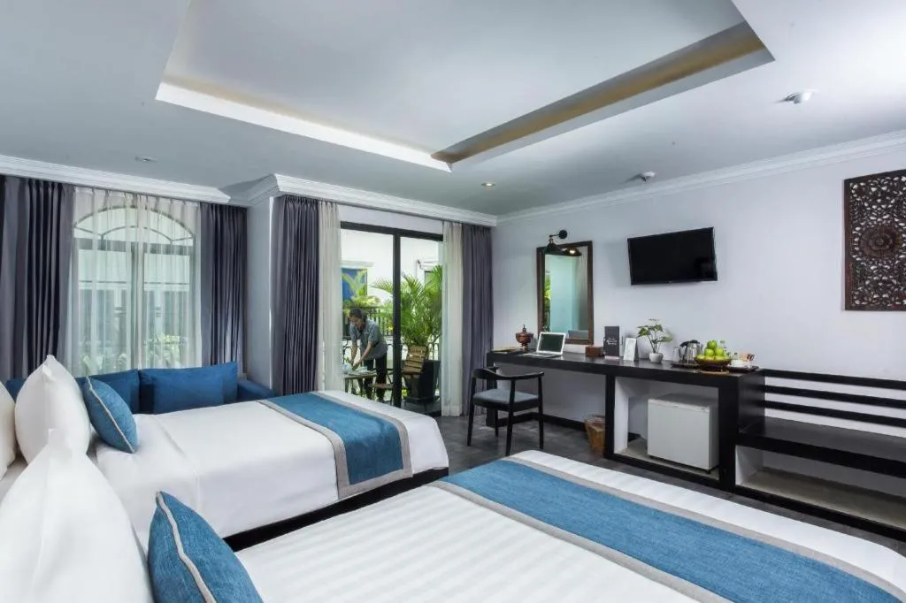 Bed in The Grand Cyclo Boutique Suite & Spa