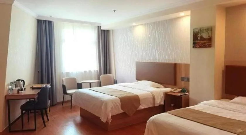 Bed in GreenTree Inn Kunshan Shimao Plaza Business Hotel