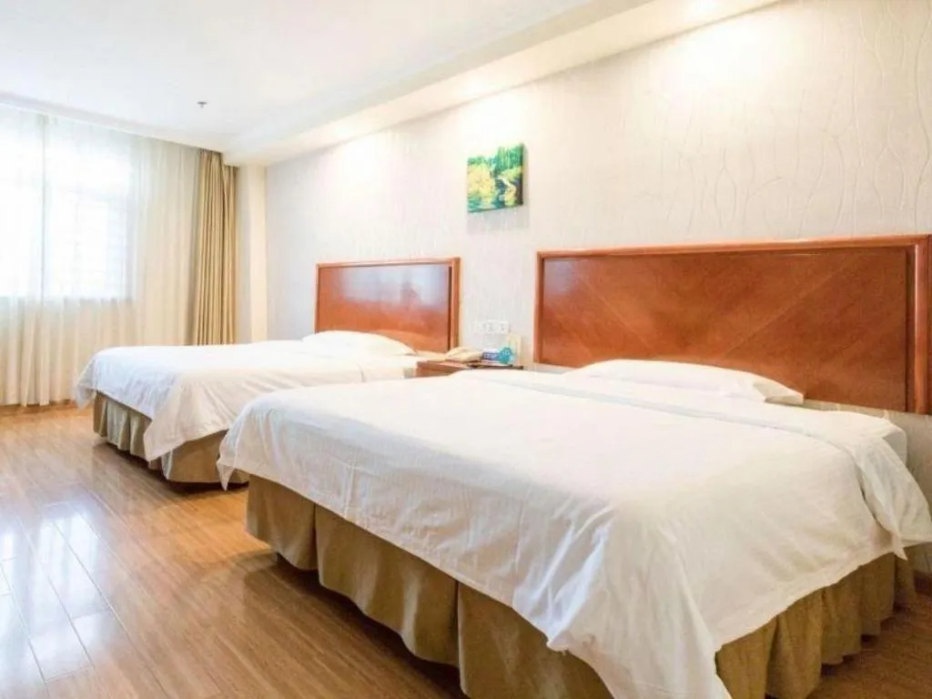 Bed in GreenTree Inn Kunshan Shimao Plaza Business Hotel