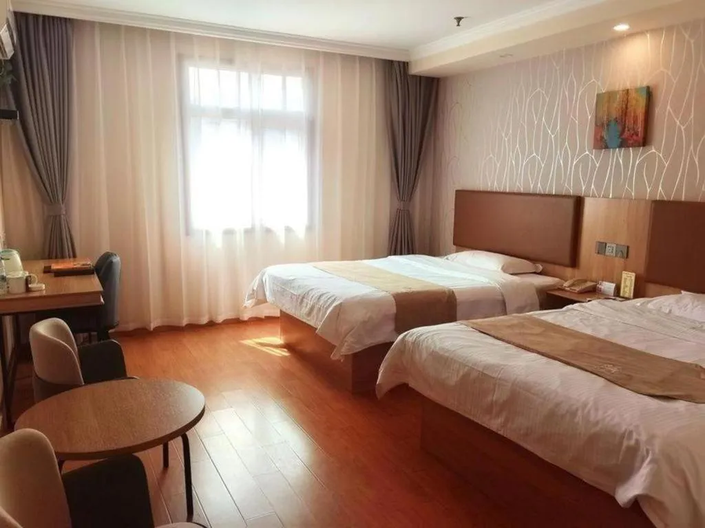 Bed in GreenTree Inn Kunshan Shimao Plaza Business Hotel