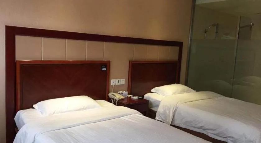 Bed in GreenTree Inn Kunshan Shimao Plaza Business Hotel