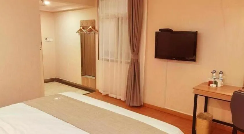 Bed in GreenTree Inn Kunshan Shimao Plaza Business Hotel