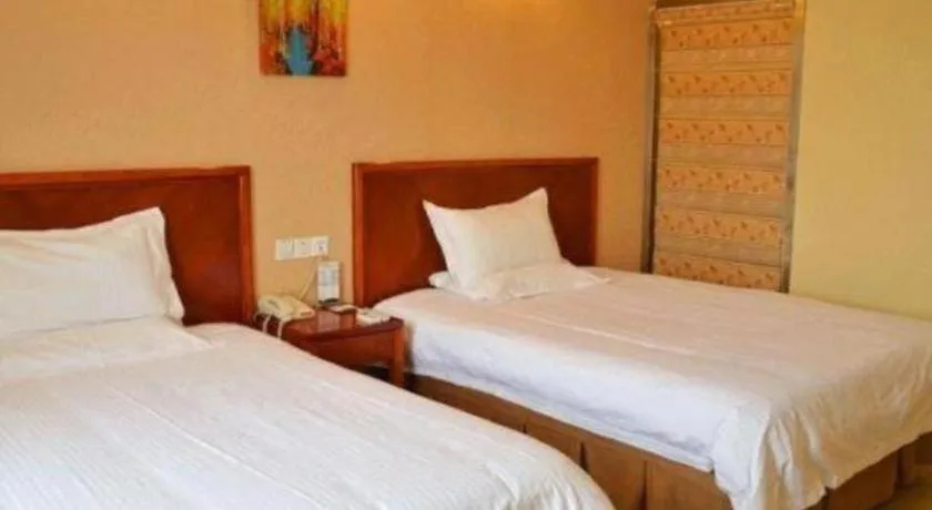 Bed in GreenTree Inn Kunshan Shimao Plaza Business Hotel
