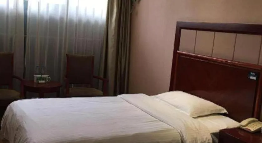 Bed in GreenTree Inn Kunshan Shimao Plaza Business Hotel
