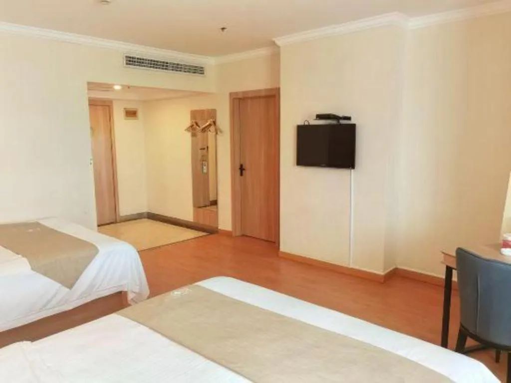 Bed in GreenTree Inn Kunshan Shimao Plaza Business Hotel