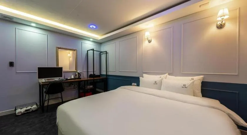 Bed in Gray Hotel