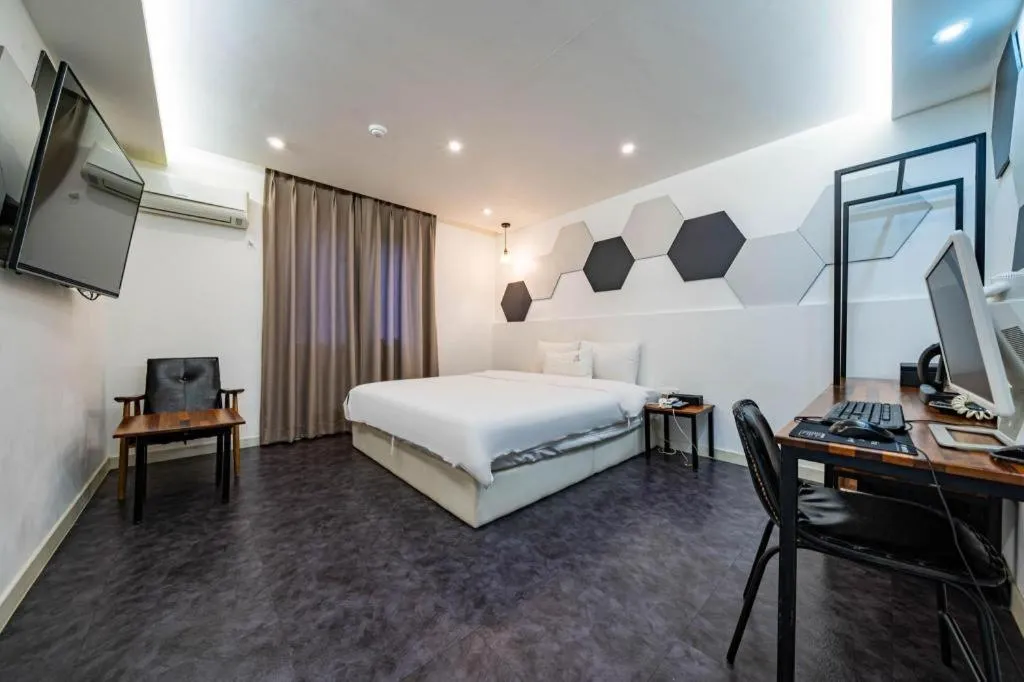 Bed in Gray Hotel