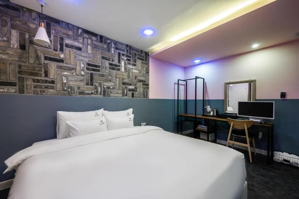 Bed in Gray Hotel