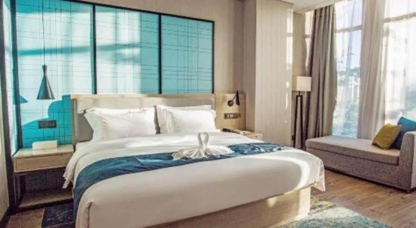 Bed in Echarm Hotel Qionghai Wanquan River