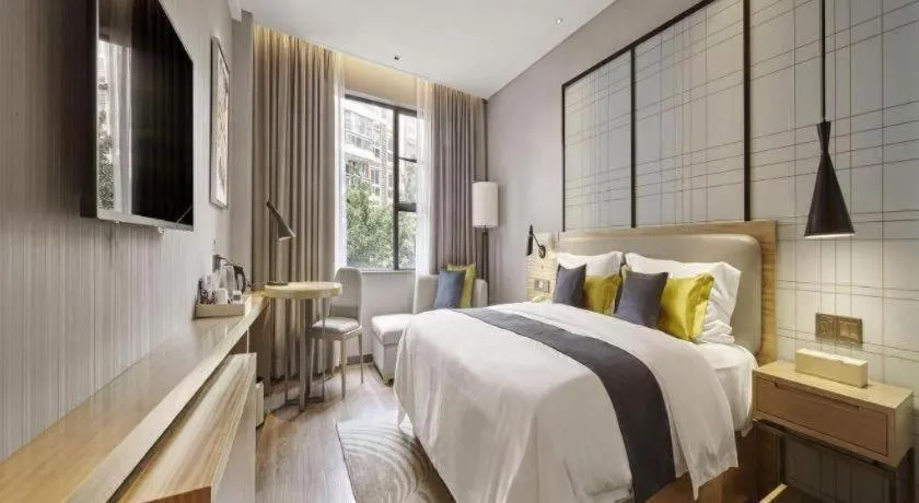 Bed in Echarm Hotel Qionghai Wanquan River