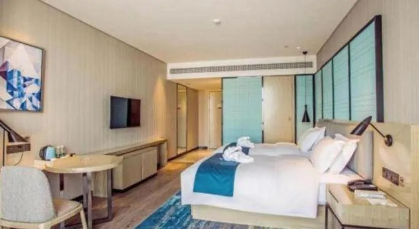 Bed in Echarm Hotel Qionghai Wanquan River