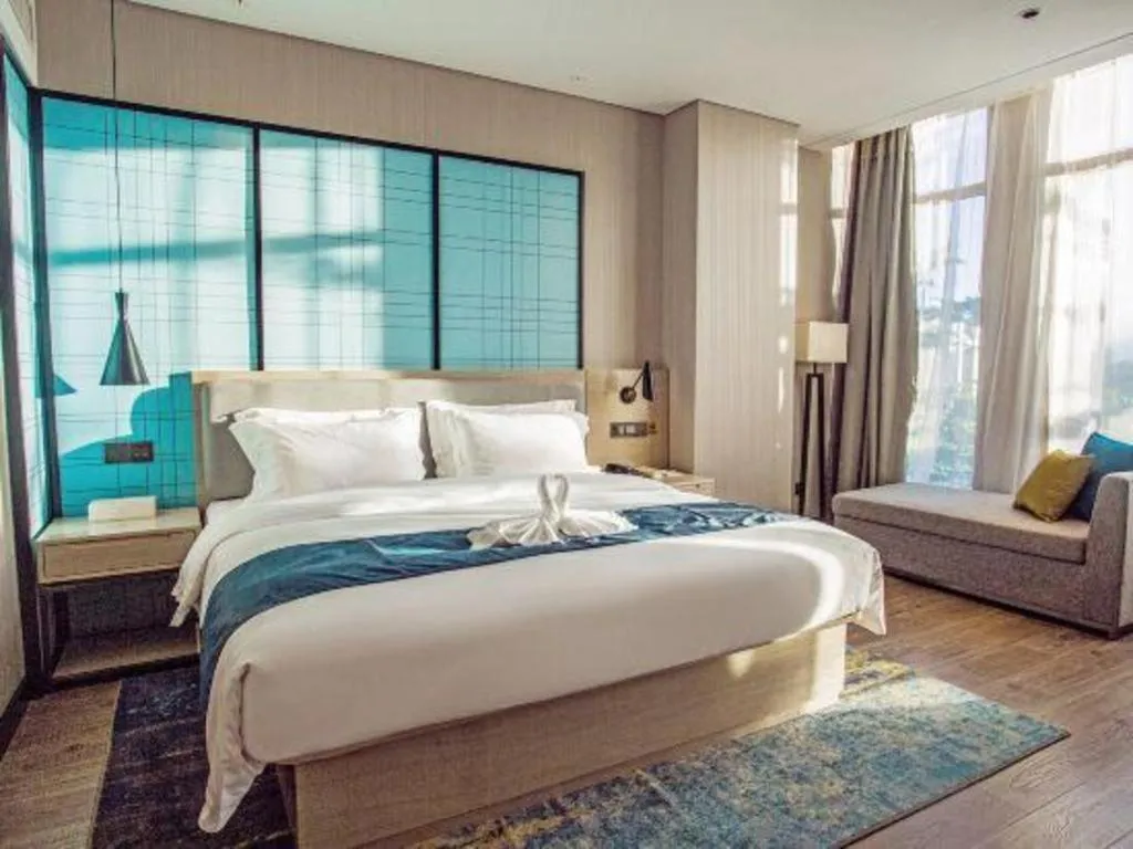 Bed in Echarm Hotel Qionghai Wanquan River