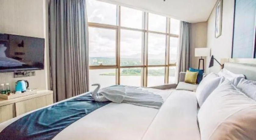 Bed in Echarm Hotel Qionghai Wanquan River