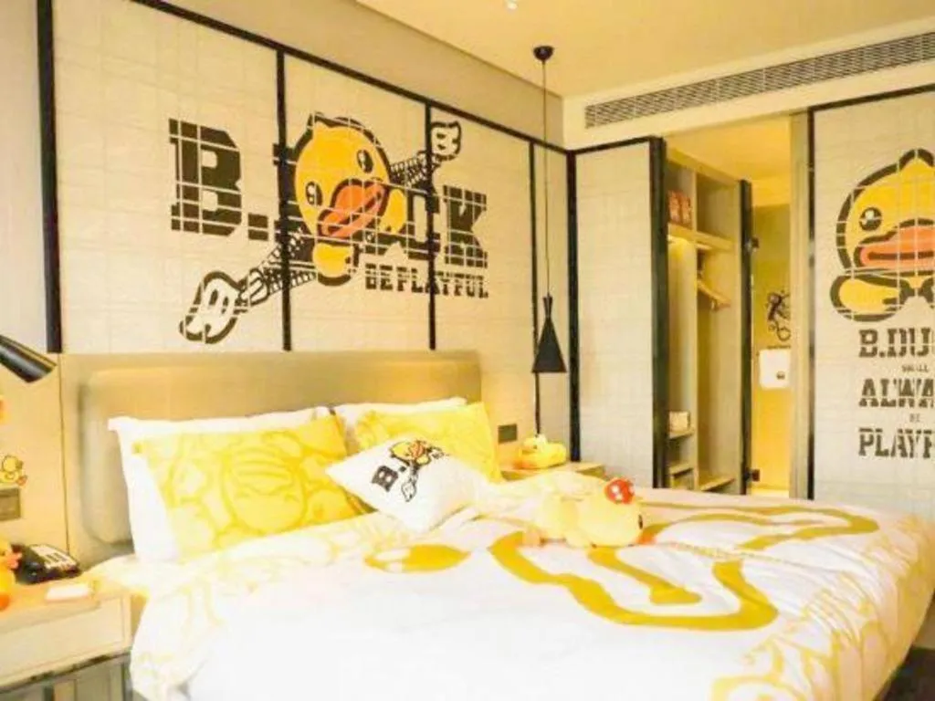 Bed in Echarm Hotel Qionghai Wanquan River