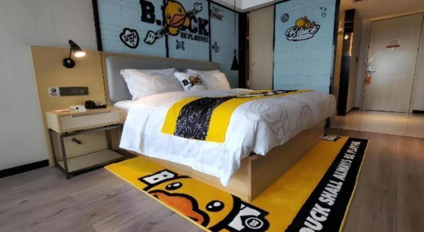 Bed in Echarm Hotel Qionghai Wanquan River