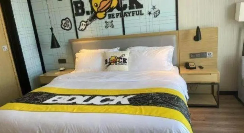 Bed in Echarm Hotel Qionghai Wanquan River