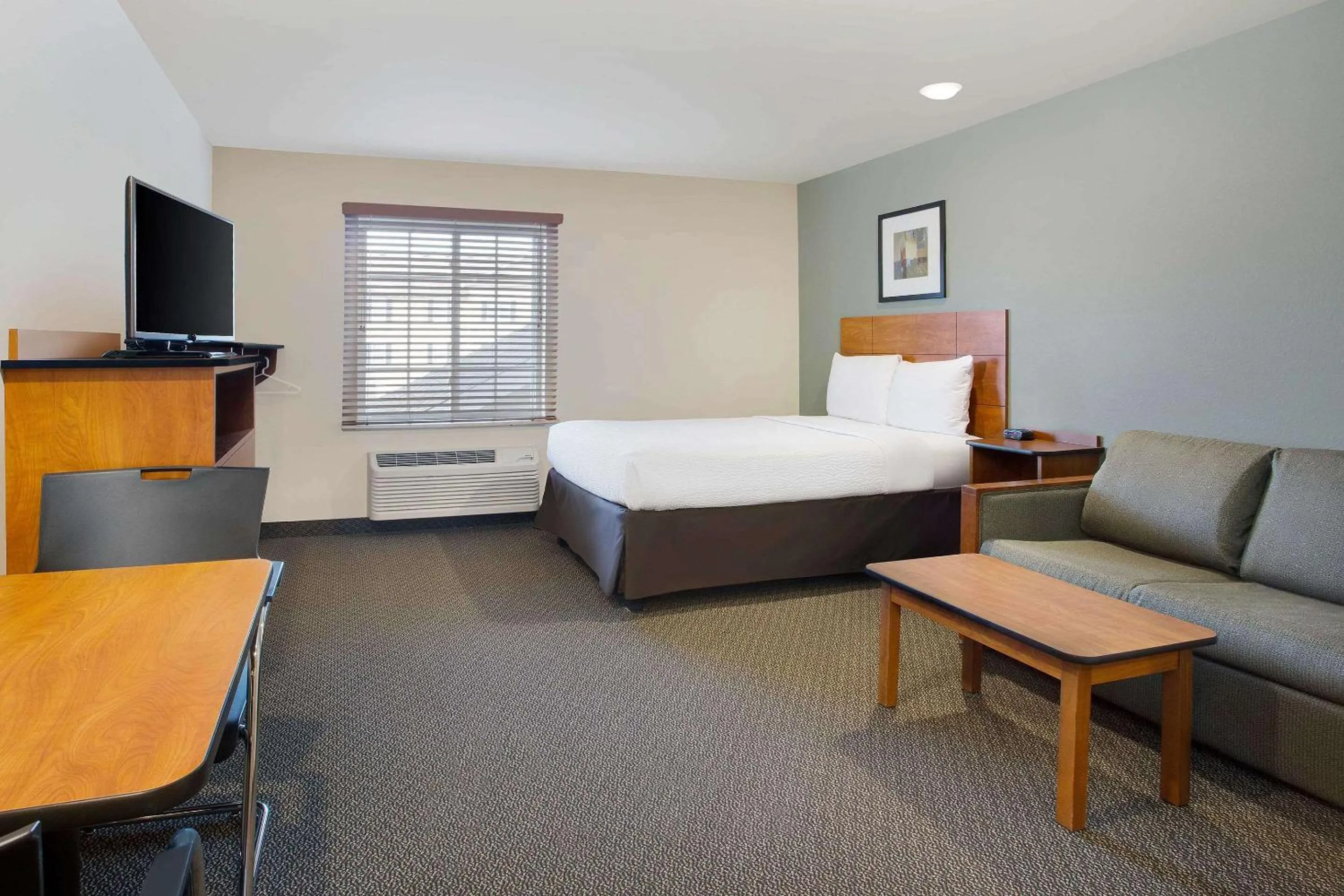 Photo of the whole room, Bed in WoodSpring Suites Columbus North I-270