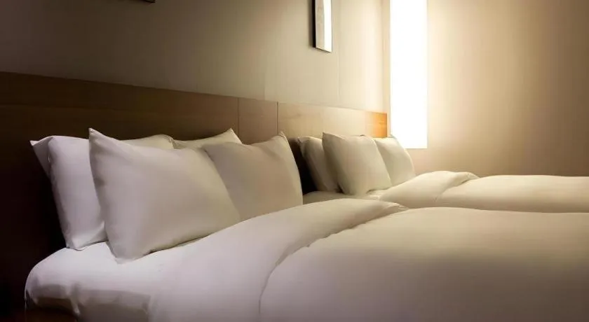 Bed in Top Cloud Hotel Iksan