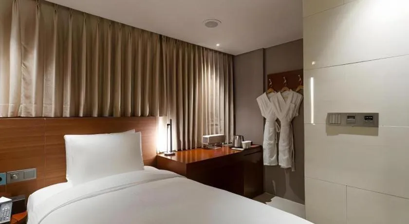 Bed in Top Cloud Hotel Iksan