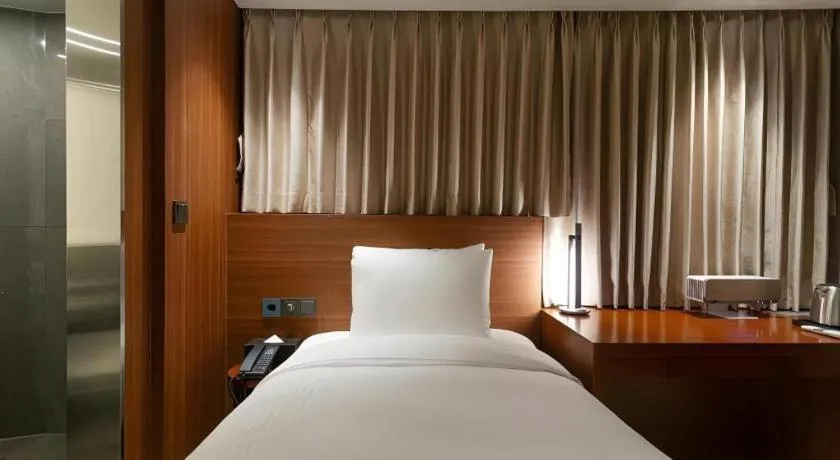 Bed in Top Cloud Hotel Iksan