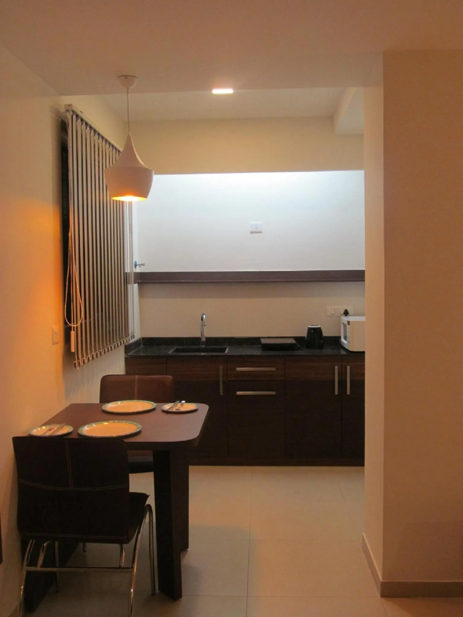 Kitchen or kitchenette in Ixora Suites