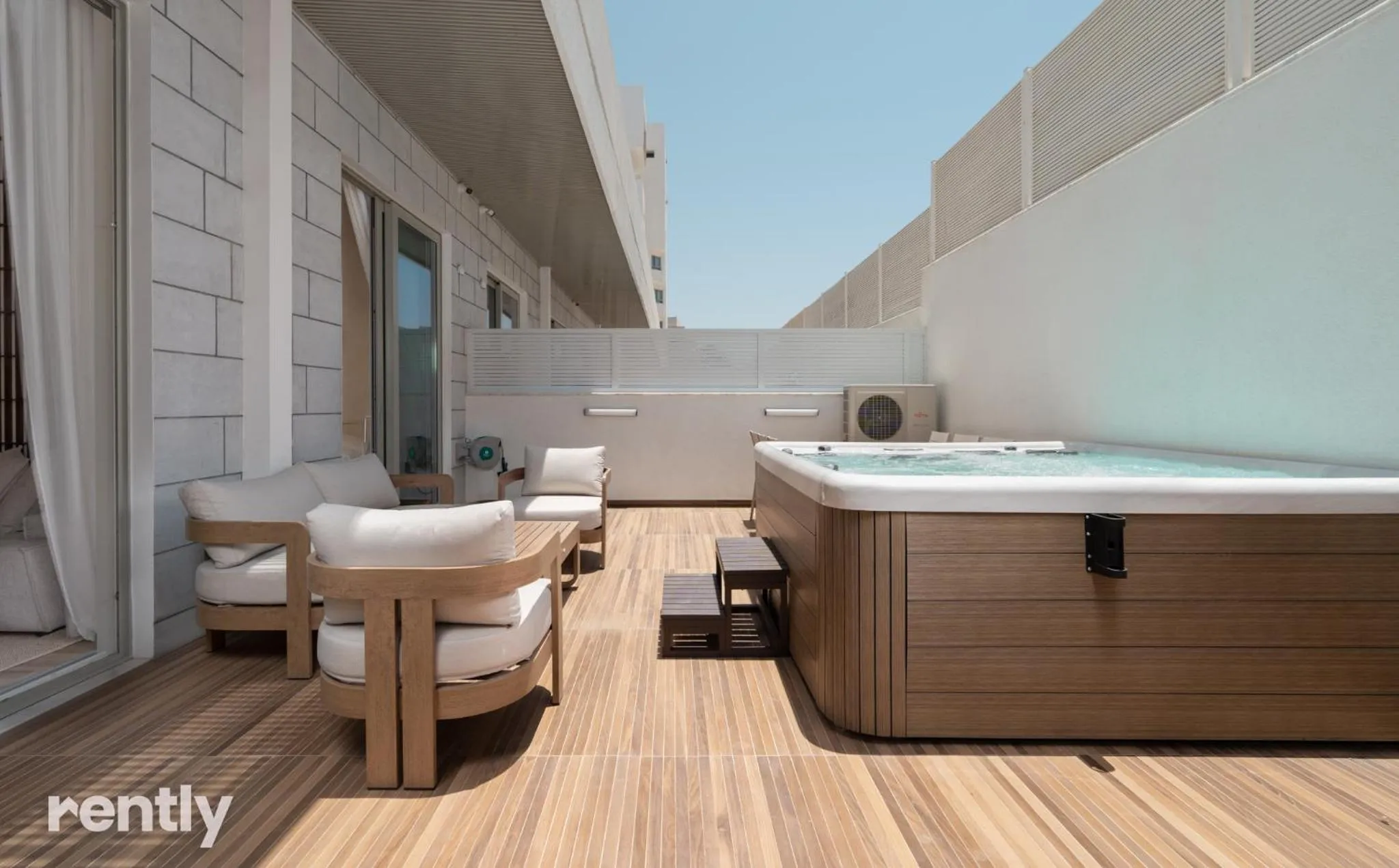Hot Tub in Luxury Suites With Balcony And Jacuzzi At Sea Side By Rently