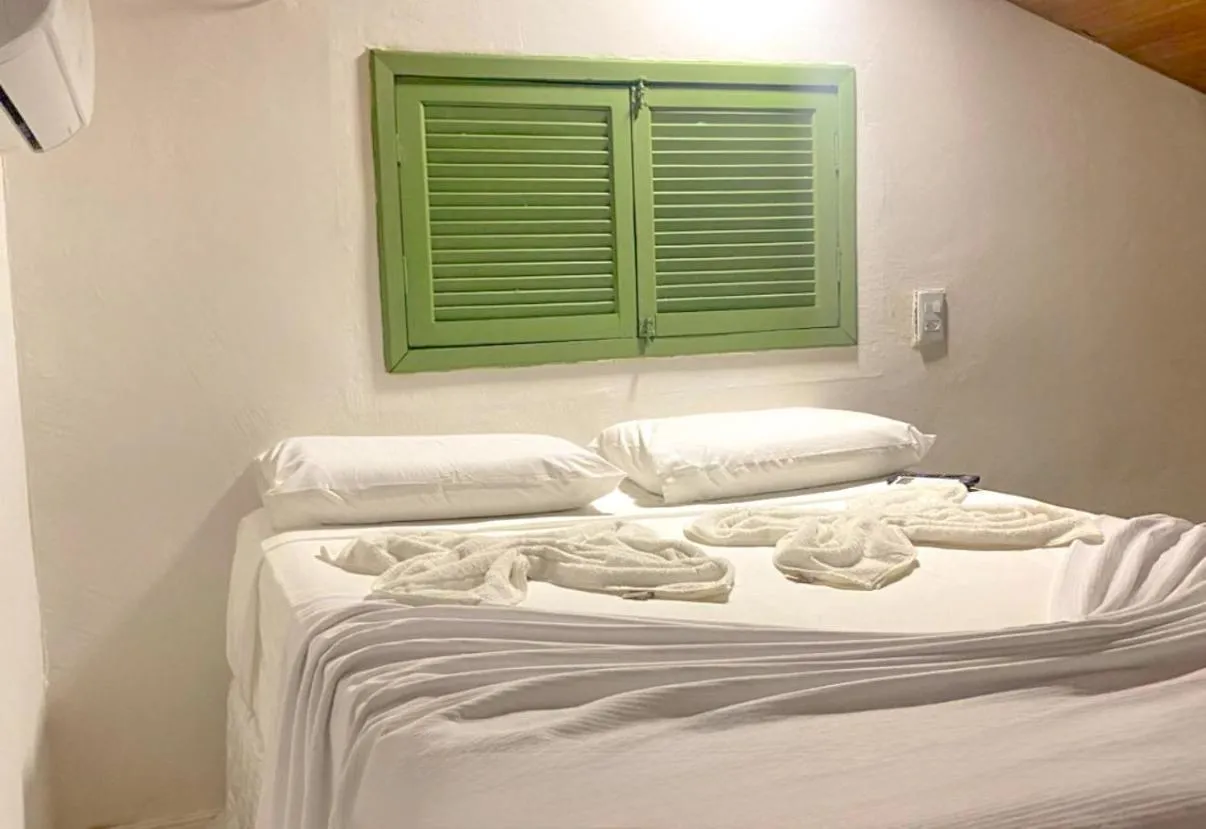 Bed in Pousada Maracaju